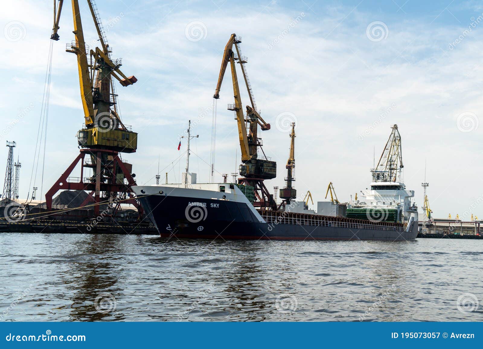 Loading and Unloading Crane Mounted on a Small Barge Editorial