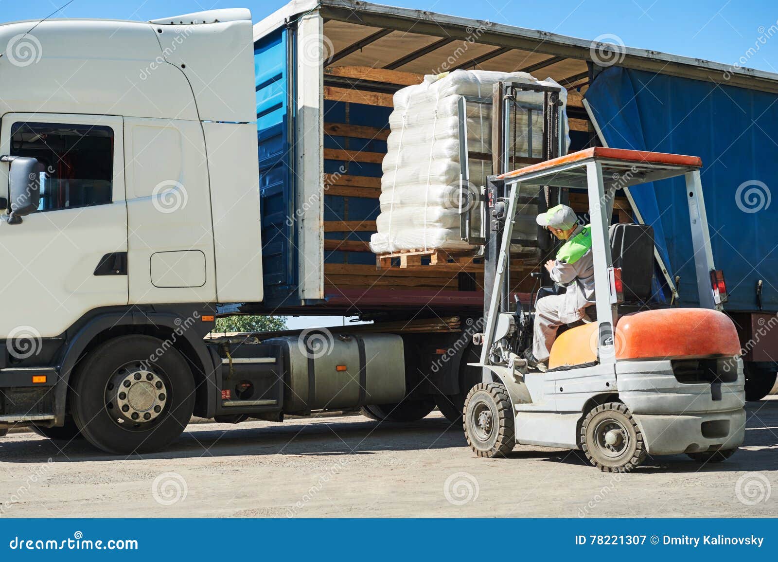 loading works. forklift with load and lorry truck