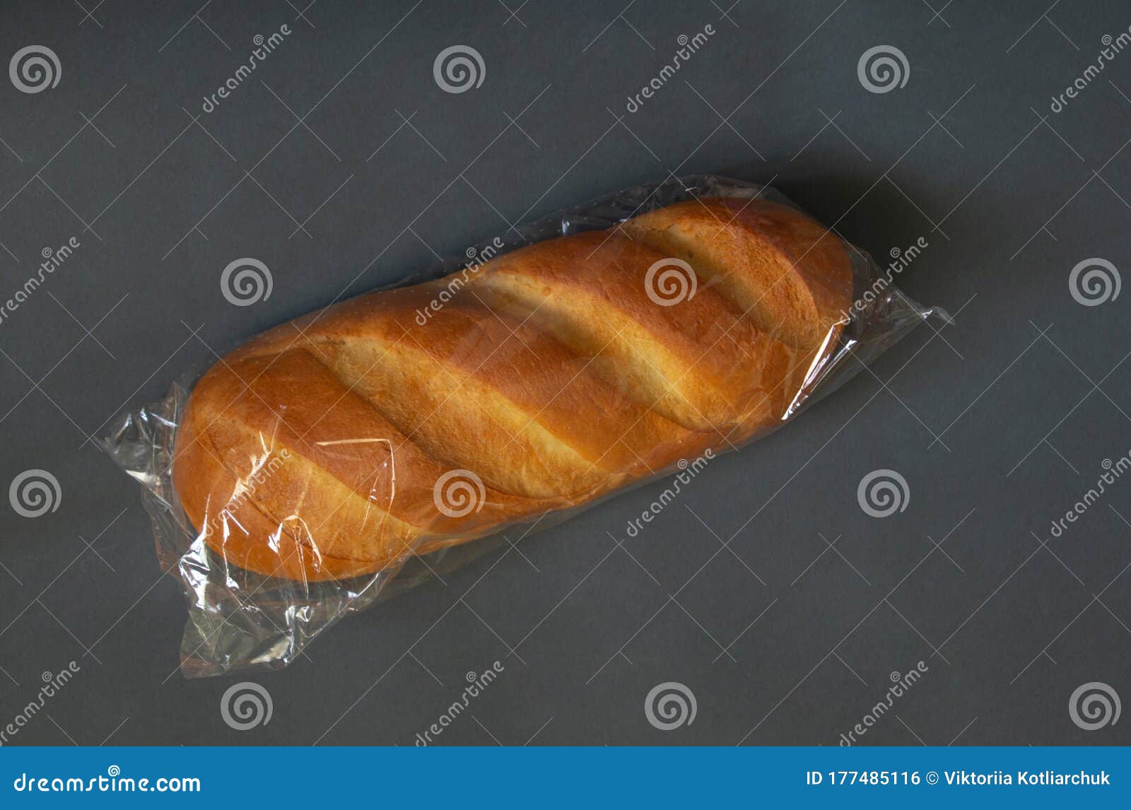 Loaf Of White Bread In A Package On A Dark Isolated Background Stock