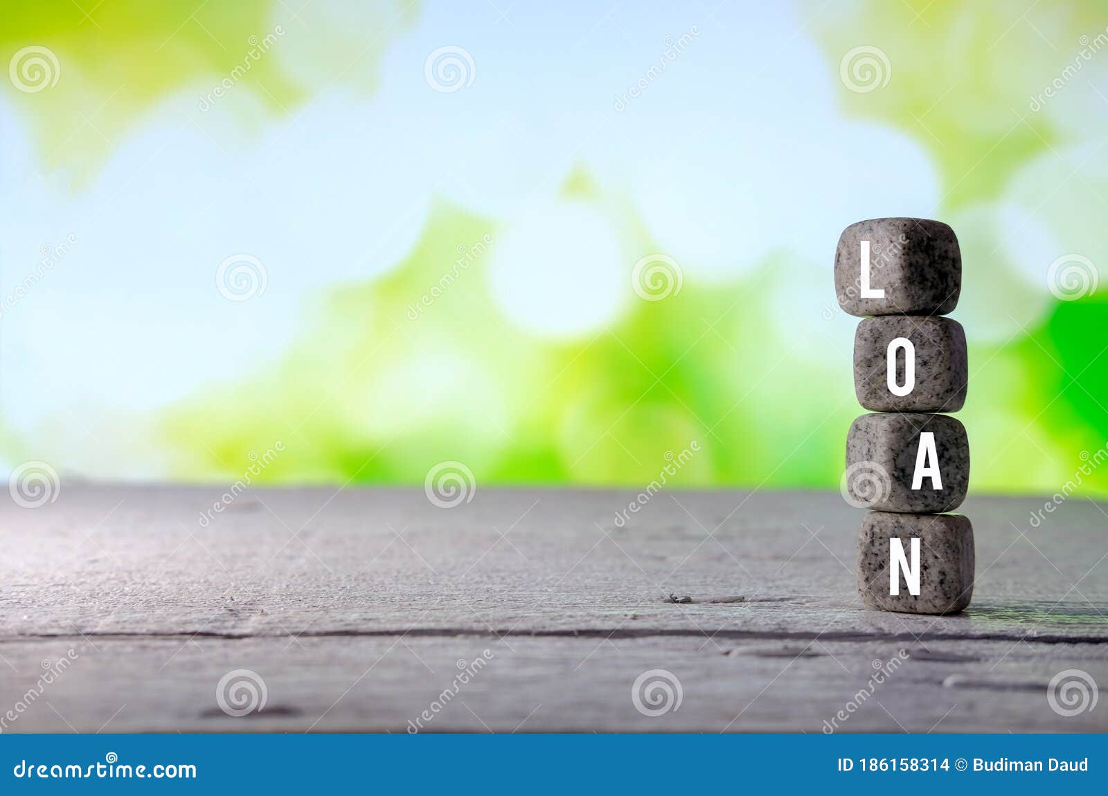 LOAN Text on Stone Block on Greeny Background Stock Photo - Image of