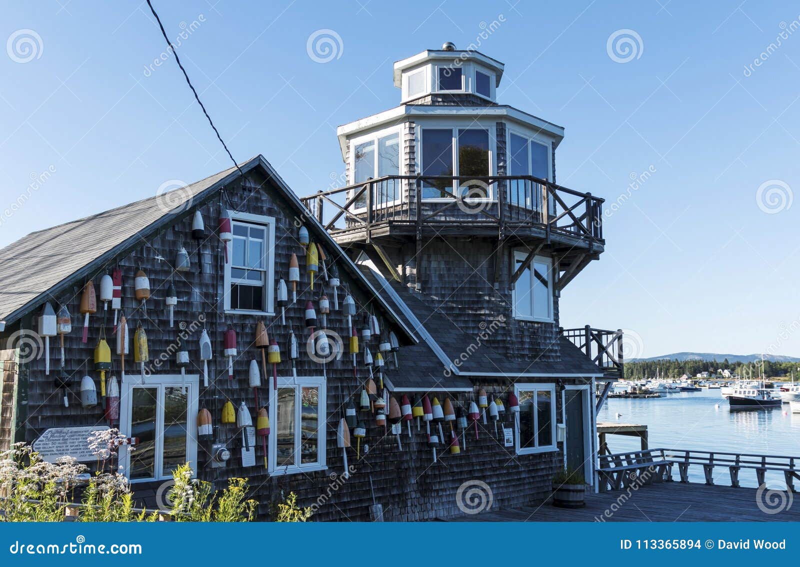 Lobster Buoys on the Clarence Harding House in Maine Editorial