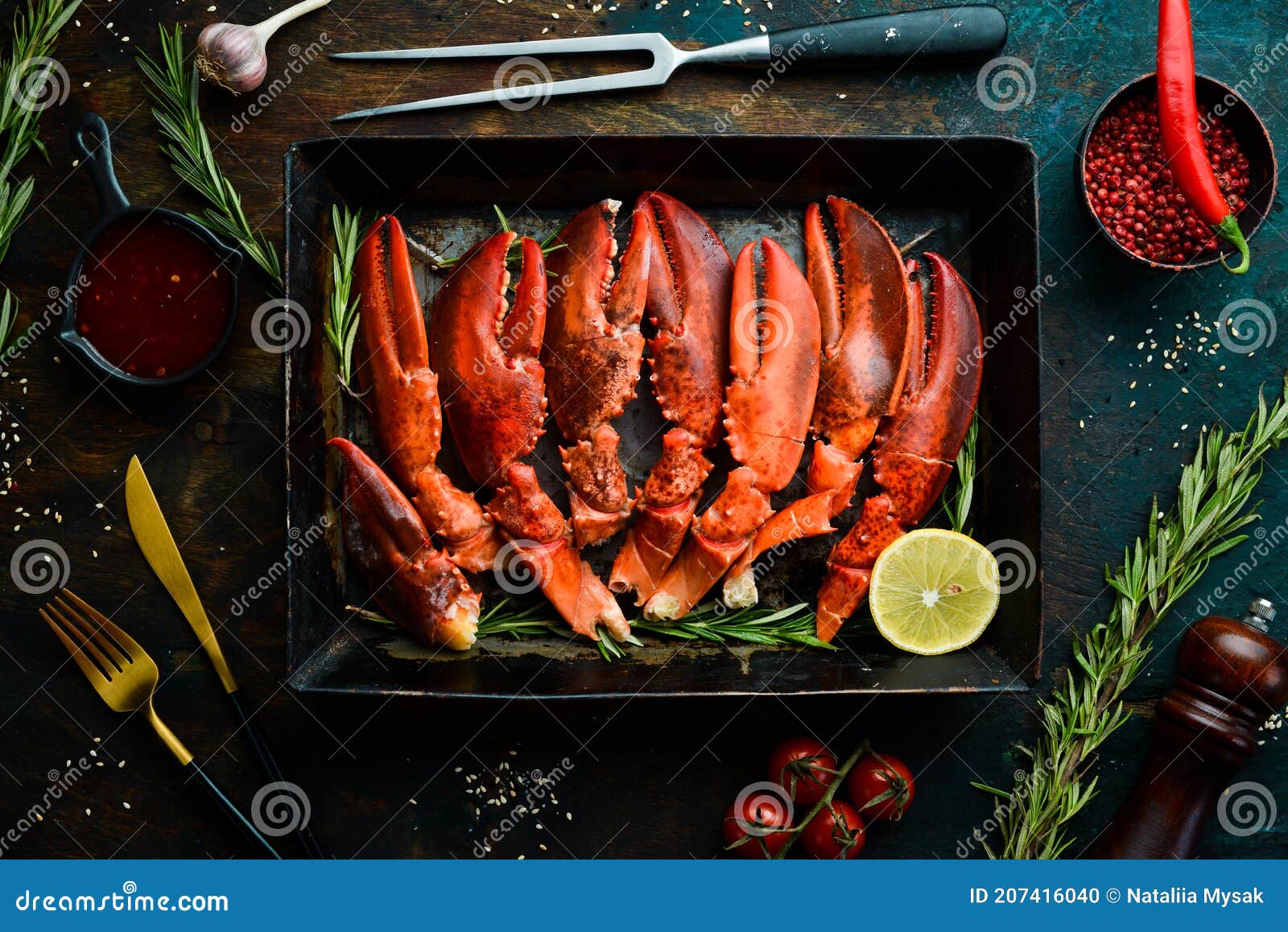 lobster claws. boiled crustacean claws on a black stone background.