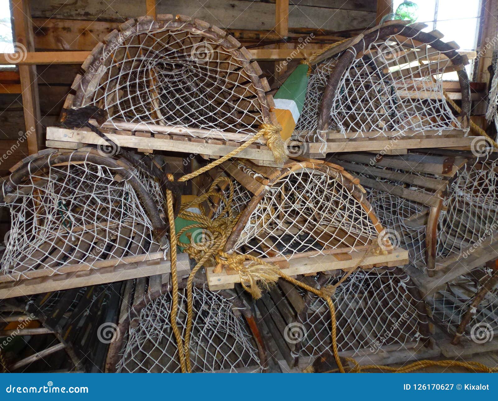 Old Wooden Lobster Traps Stacking on Pier in Nova Scotia Stock