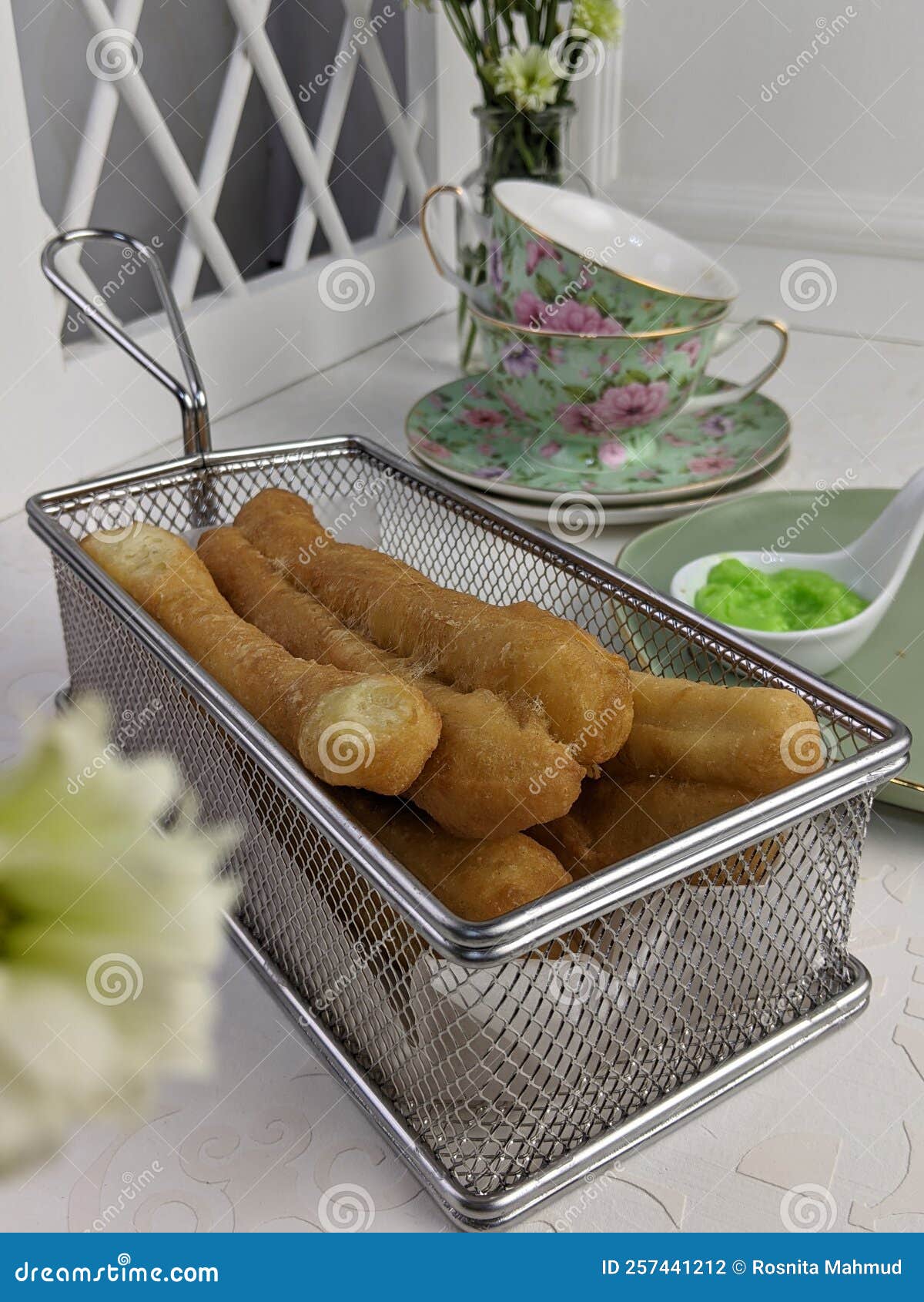 local breadstick called cakoi or youtiao a long golden brown deep fried strip of dough served for tea time
