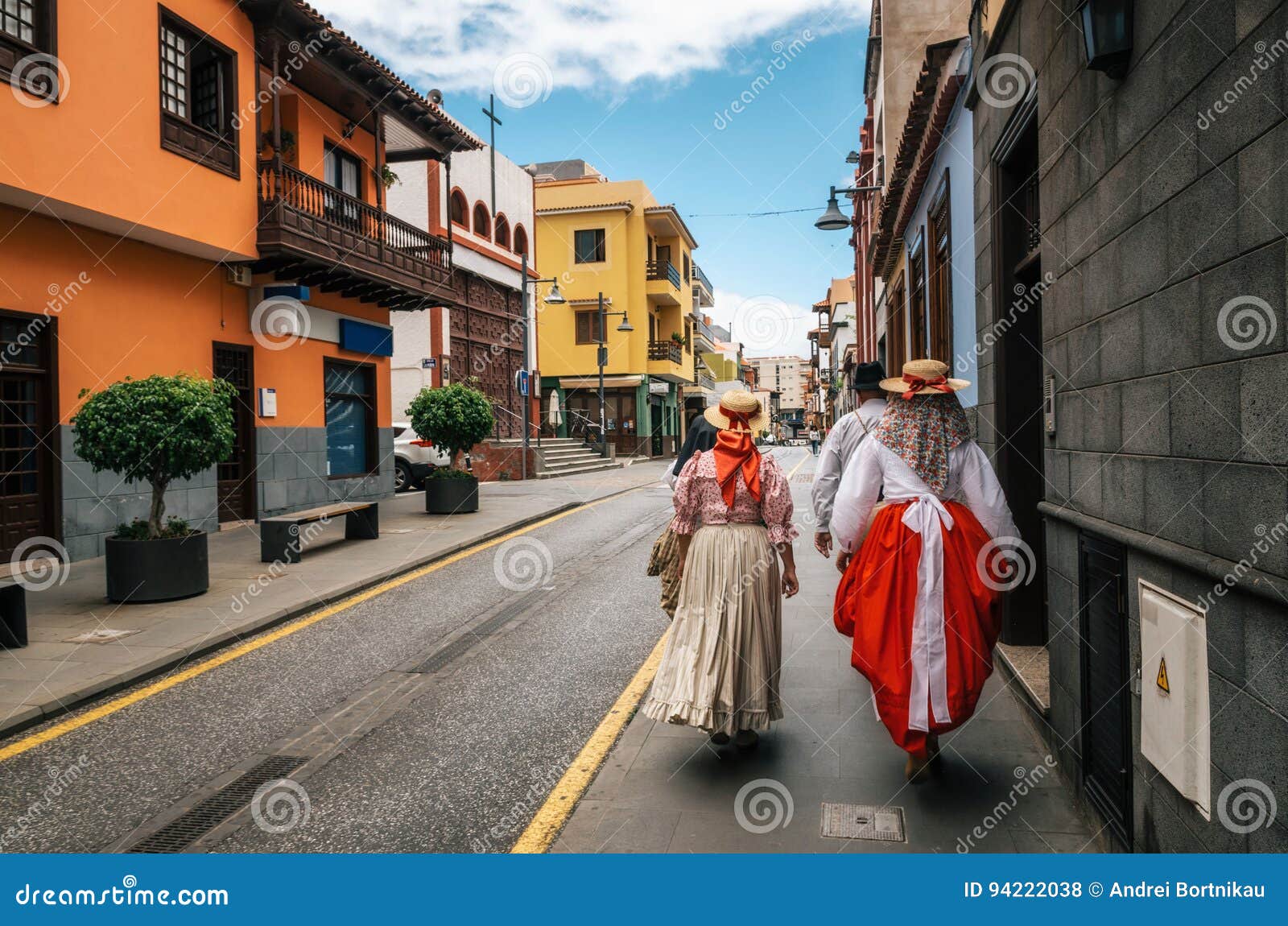 locals in canarian traditional clothes walk along the street of puerto de la cruz. day of canary islands. tenerife.