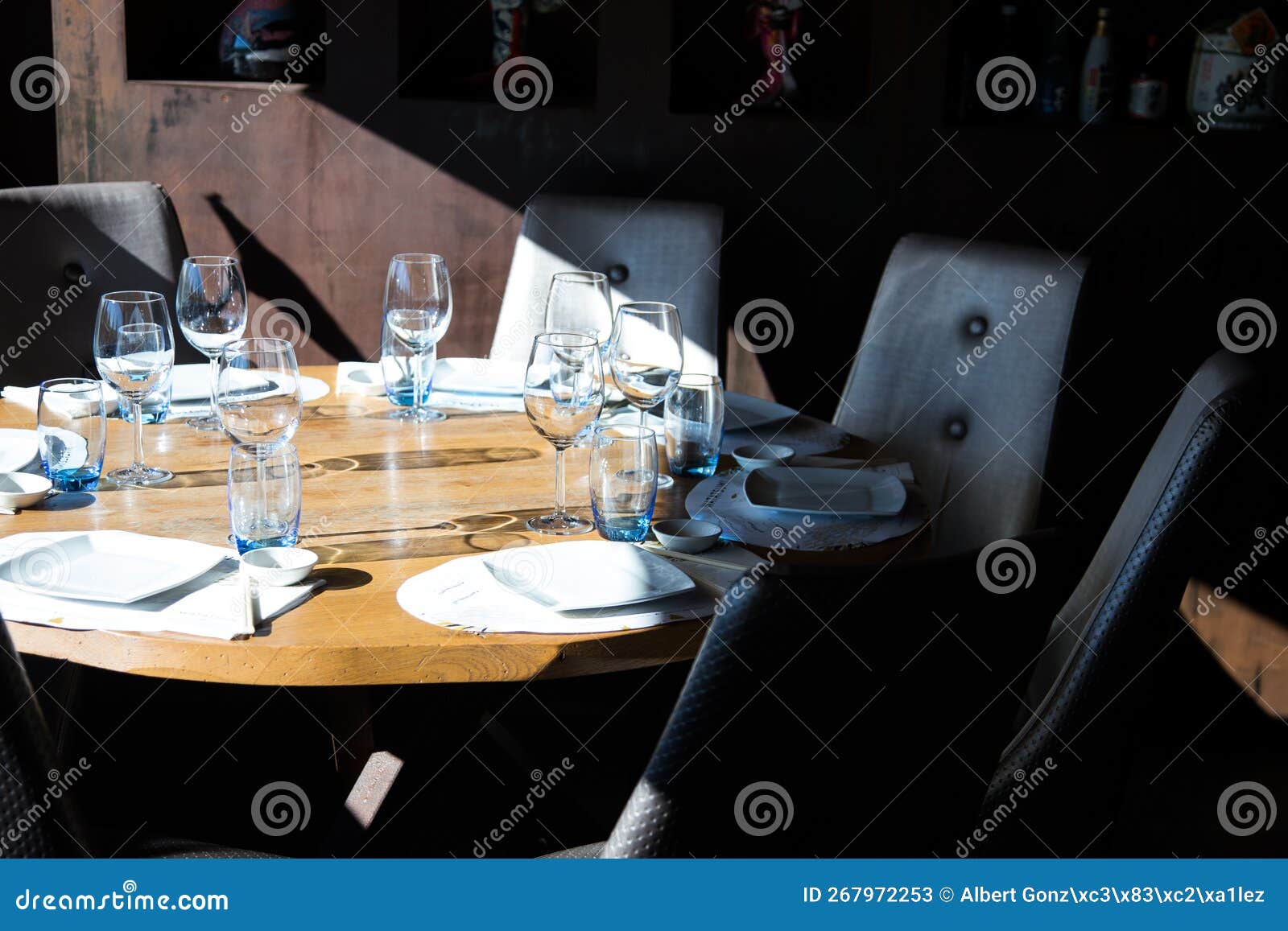 Elegant Restaurant Table with Cutlery, Crockery and Glasses. Stock