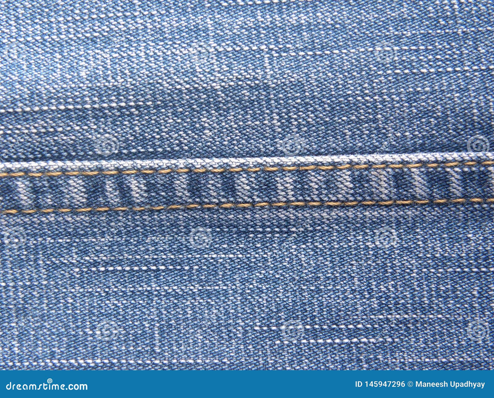 Lock Stitch on blue jeans stock photo. Image of pattern - 145947296
