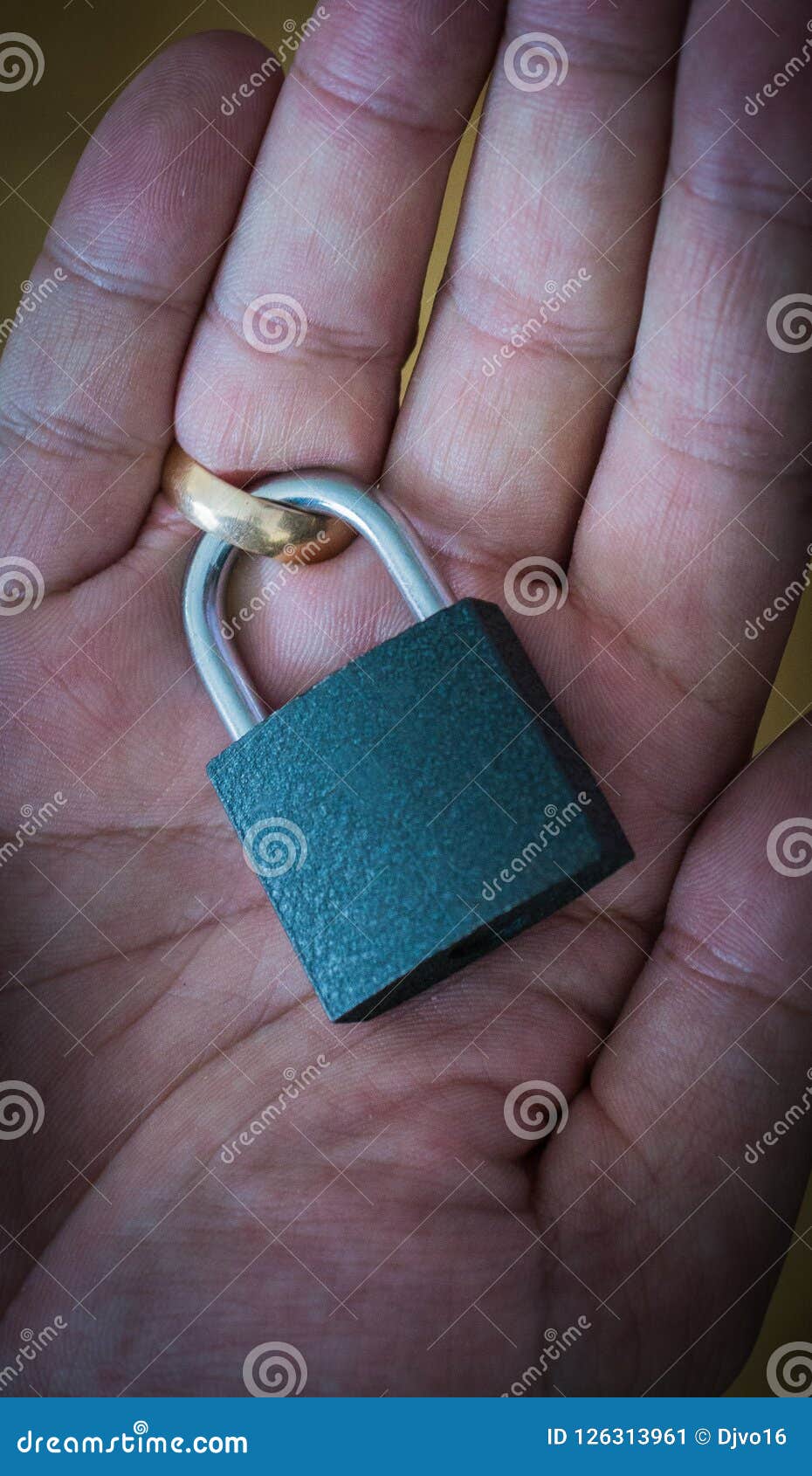 The Lock on the Wedding Ring on the Finger. Concept Marriage Contract