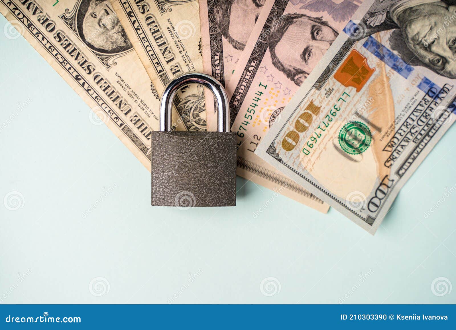 Locked Lock on Banknotes As a Concept of Financial Security of Deposits