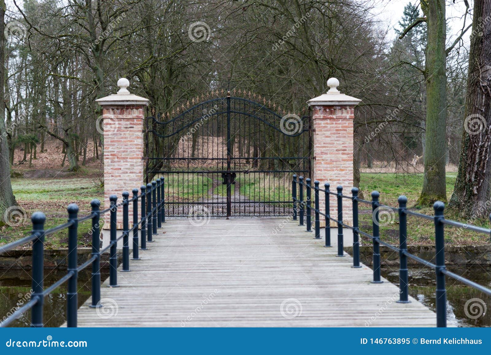 Locked Wrought Iron Gate with Two Stone Columns Stock Image Image of