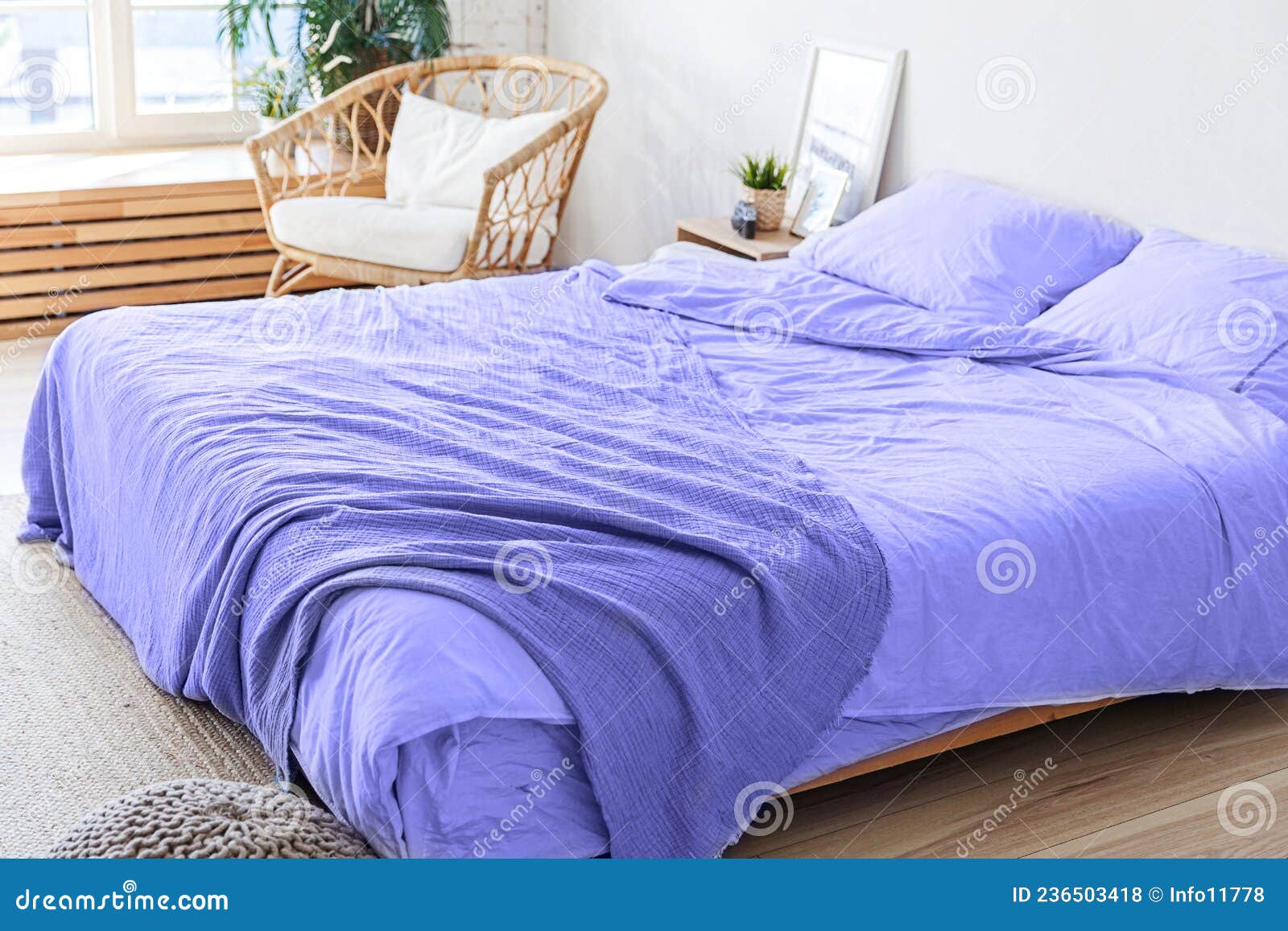 loft bedroom interior, bed linen colored in trendy color of year 2022 very peri background. inspired by using color 17