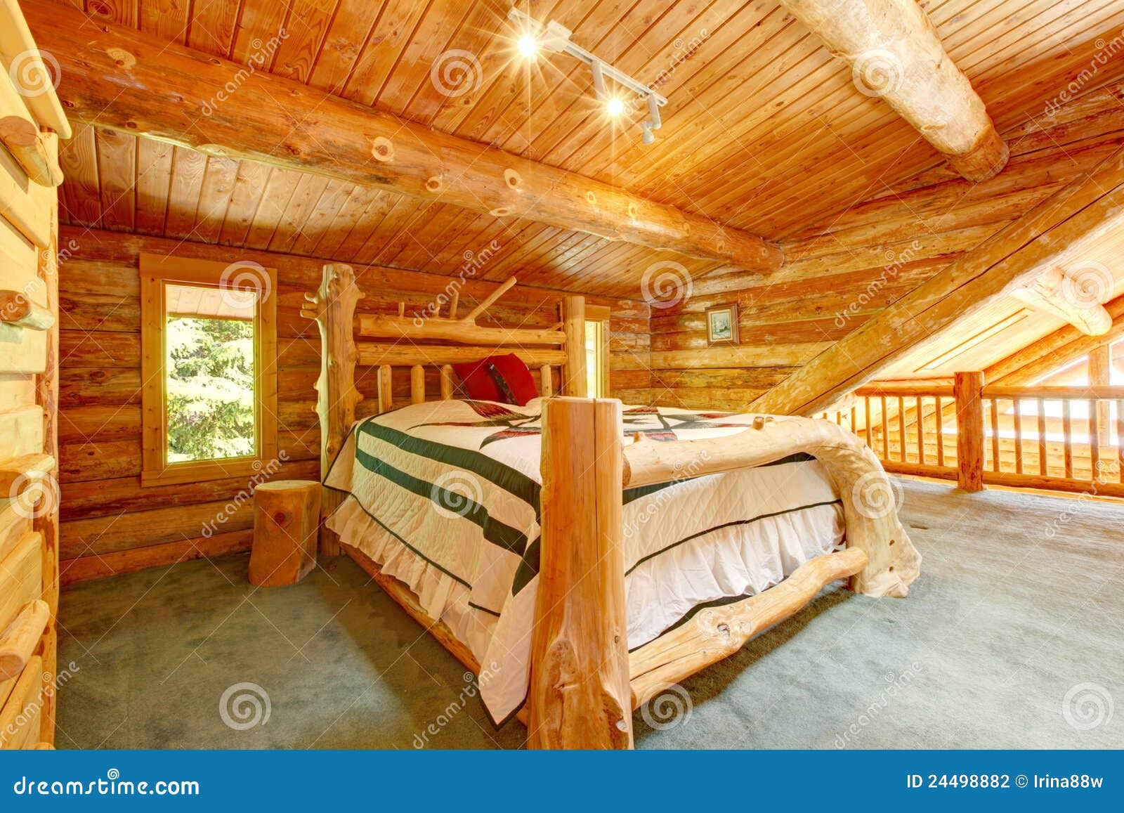 Bedroom Under The Eaves With Natural Light And Seagrass Floor Stock