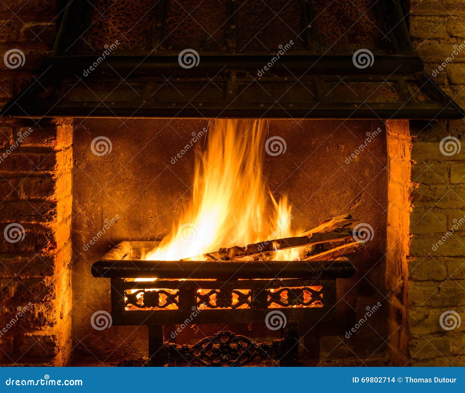 Log fire in a chimney stock photo. Image of cozy, night 69802714