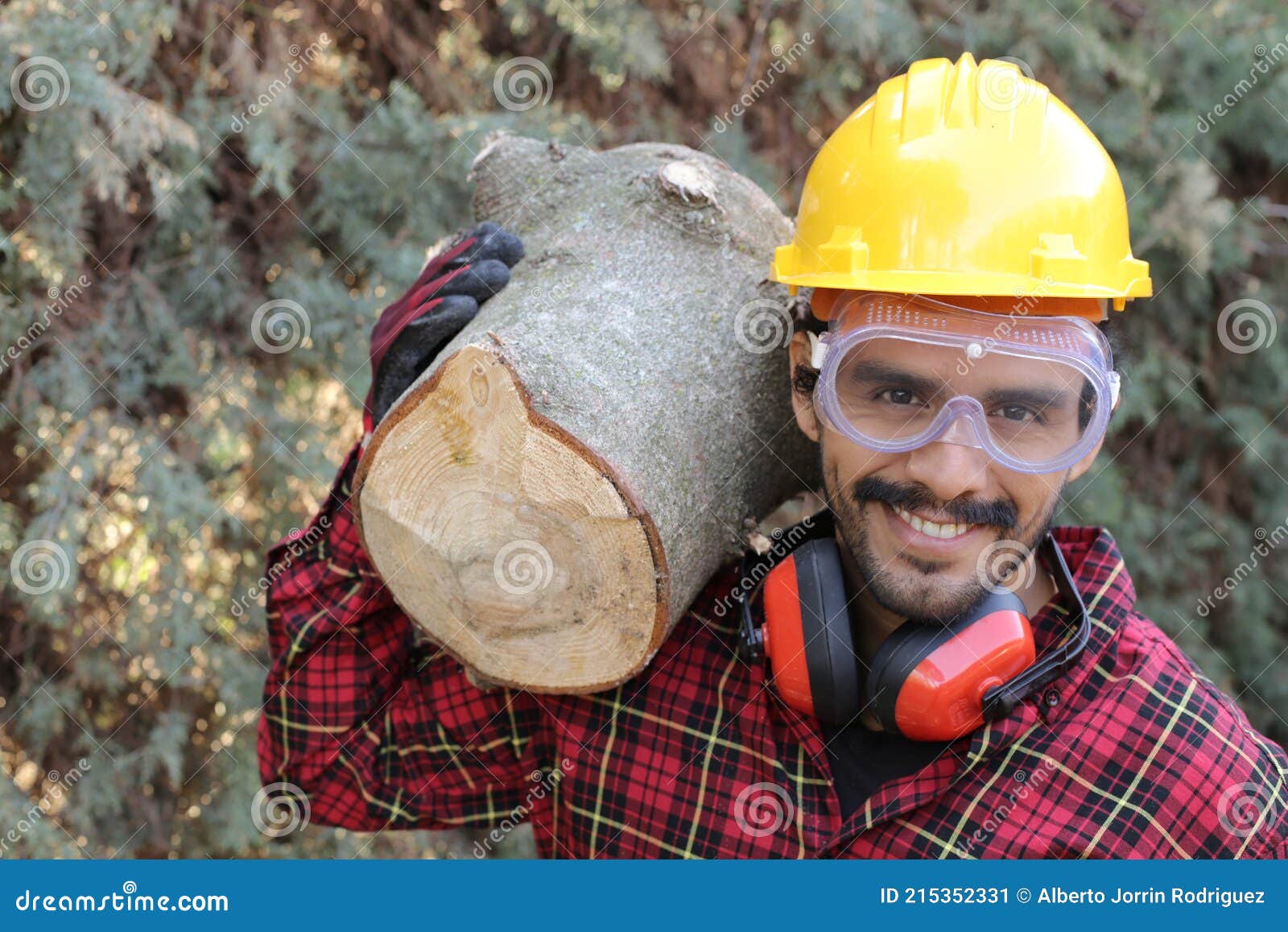 logger holding heavy trunk in the forest