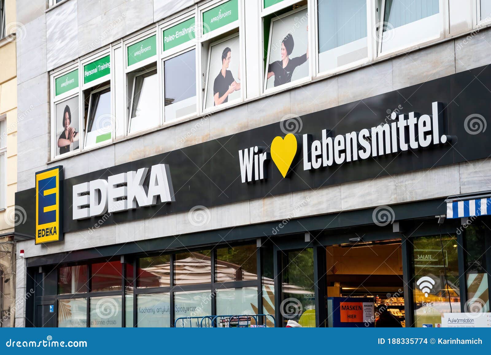 Logo on the Facade of an Edeka Store in Berlin with Text: Wir Lieben  Lebensmittel Engl.: we Love Foot Editorial Stock Image - Image of products,  heart: 188335774