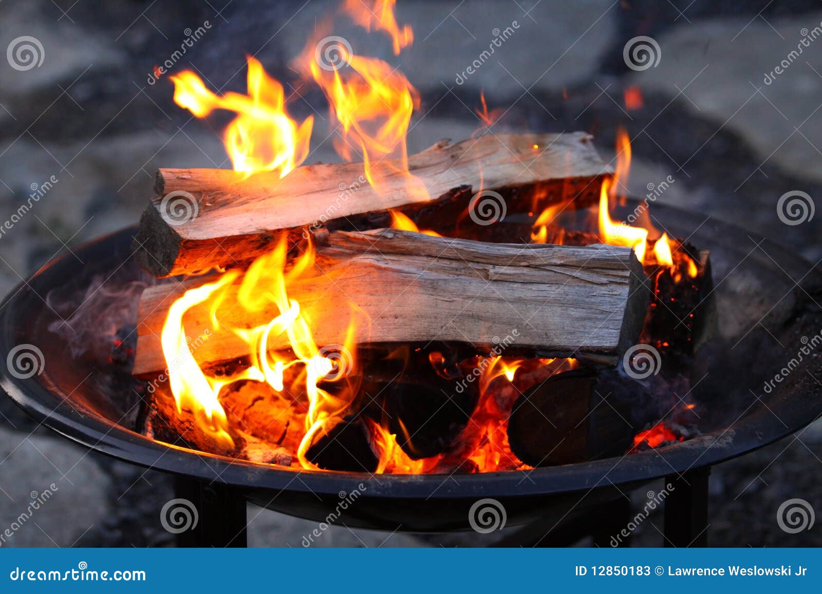 logs burning in a fire pit