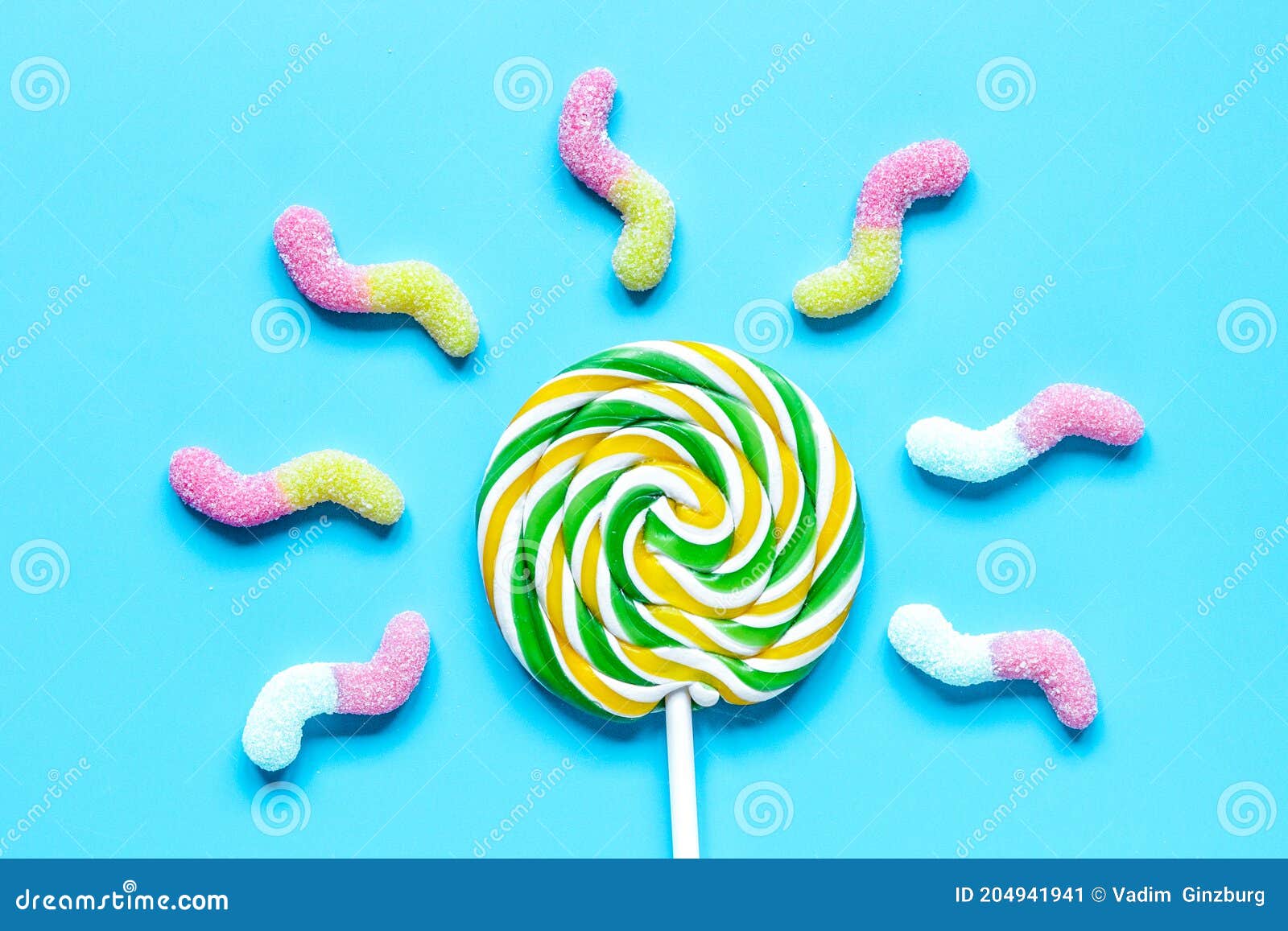 Download Lollipop Design With Sugar Candys On Blue Background Top View Mockup Stock Image Image Of Lolly Scattered 204941941