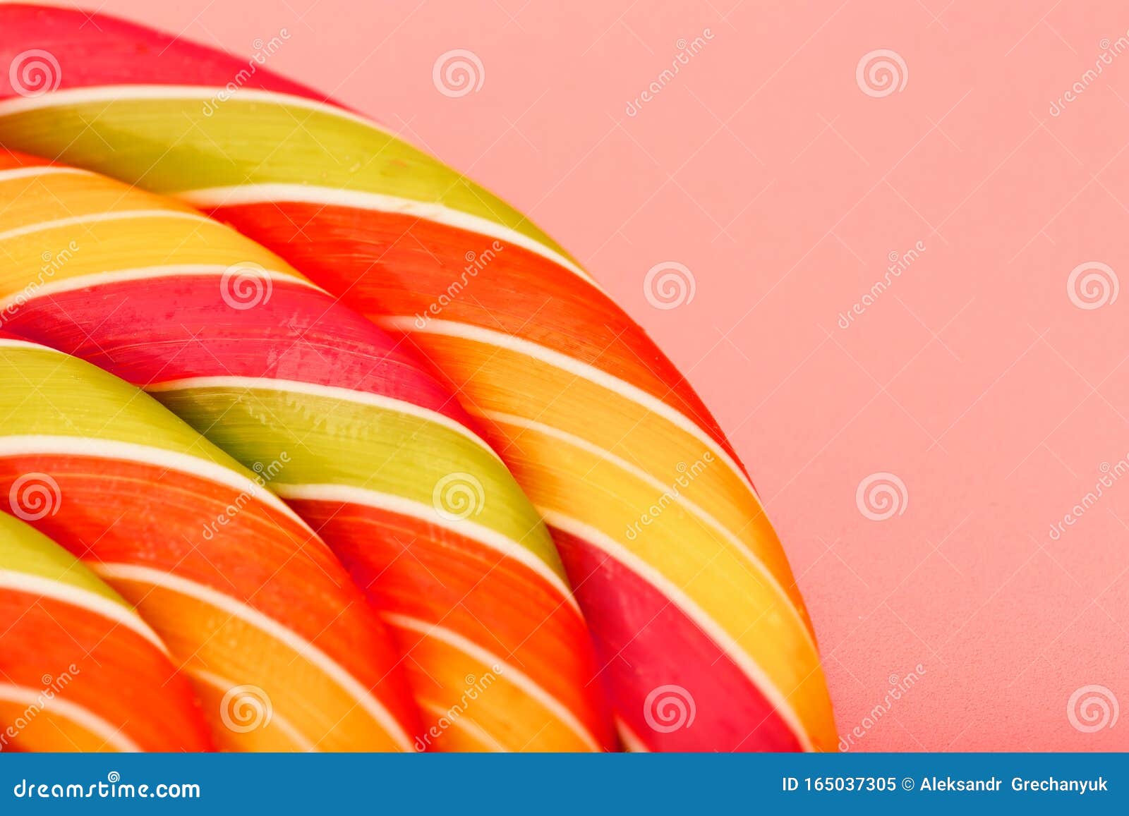 Lollipop Multicolored Close-up As Background Texture on Pieces on Pink ...