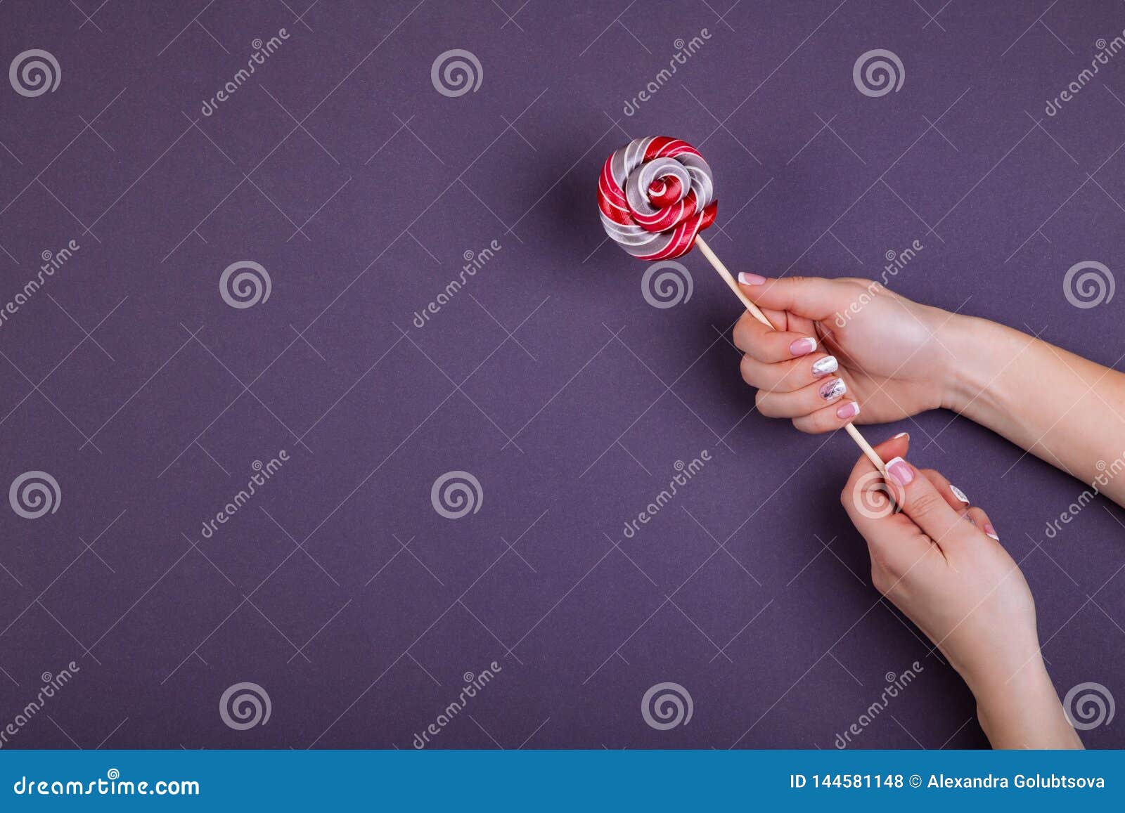 Lollypop on a Stick in Hand. Stock Photo - Image of junk, lollypop ...