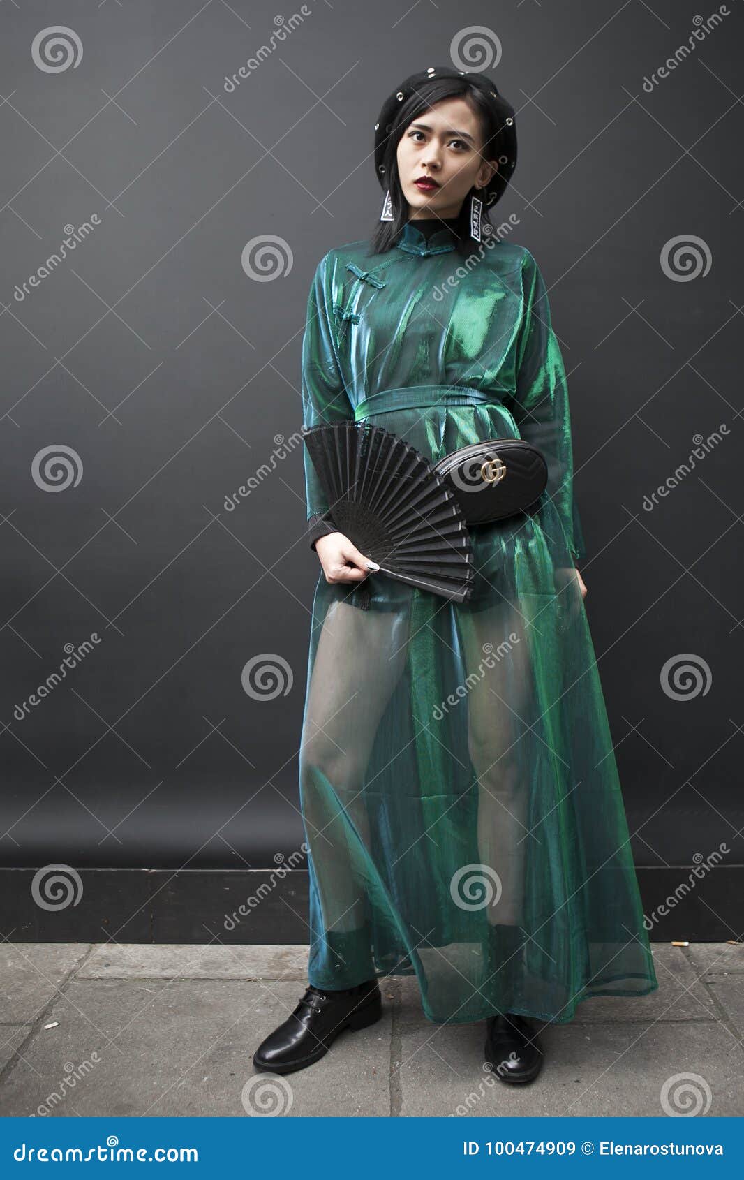 Free Photo  Girl in black dress and red beret stares into camera in  amazement and covers her mouth with hand.