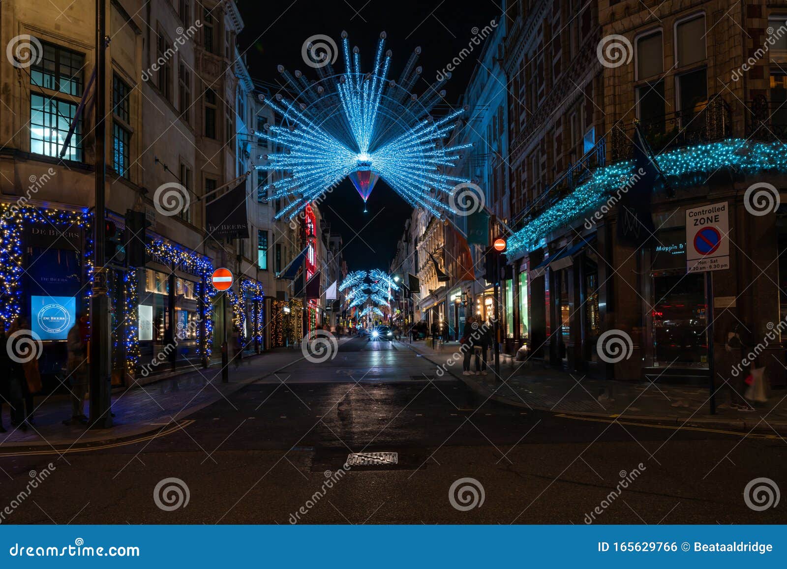 LONDON, UK - 23RD DECEMBER 2015: A View Down New Bond Street In London  During The Christmas Period Showing Building Exteriors, Decorations, People  And Traffic. Stock Photo, Picture and Royalty Free Image. Image 50394734.