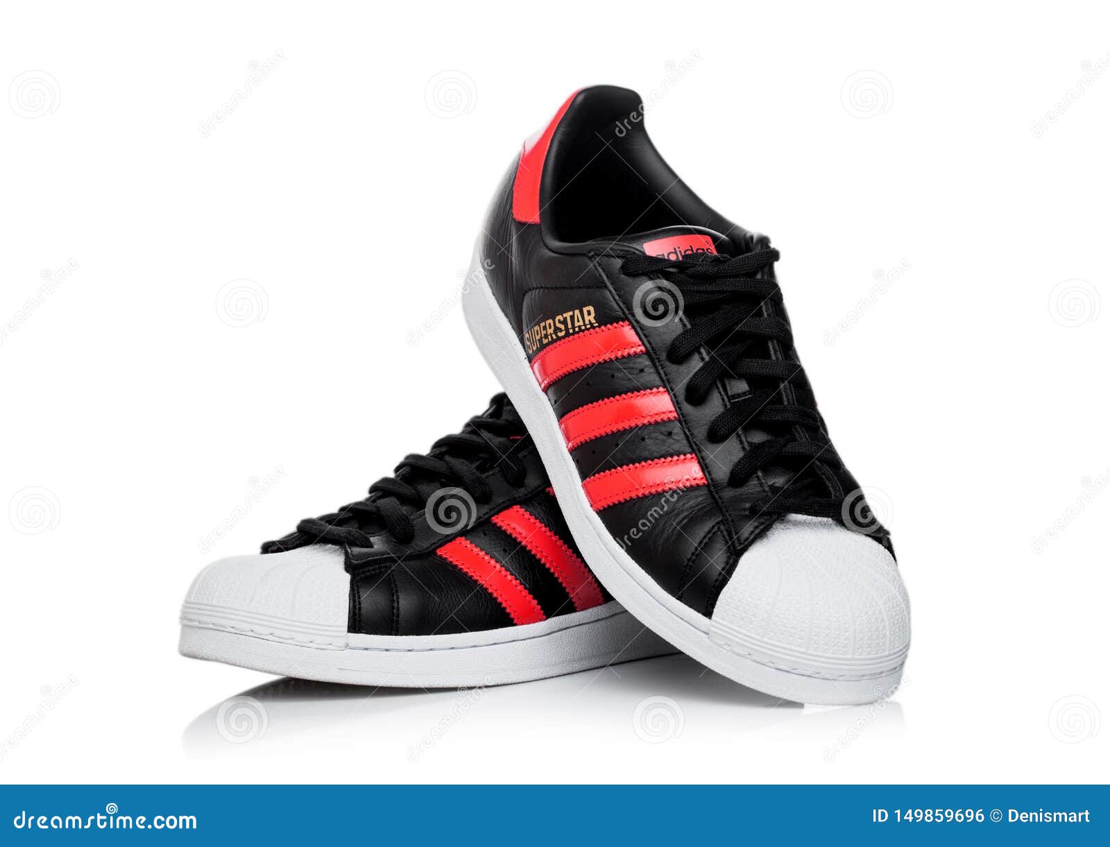 black adidas shoes with red stripes