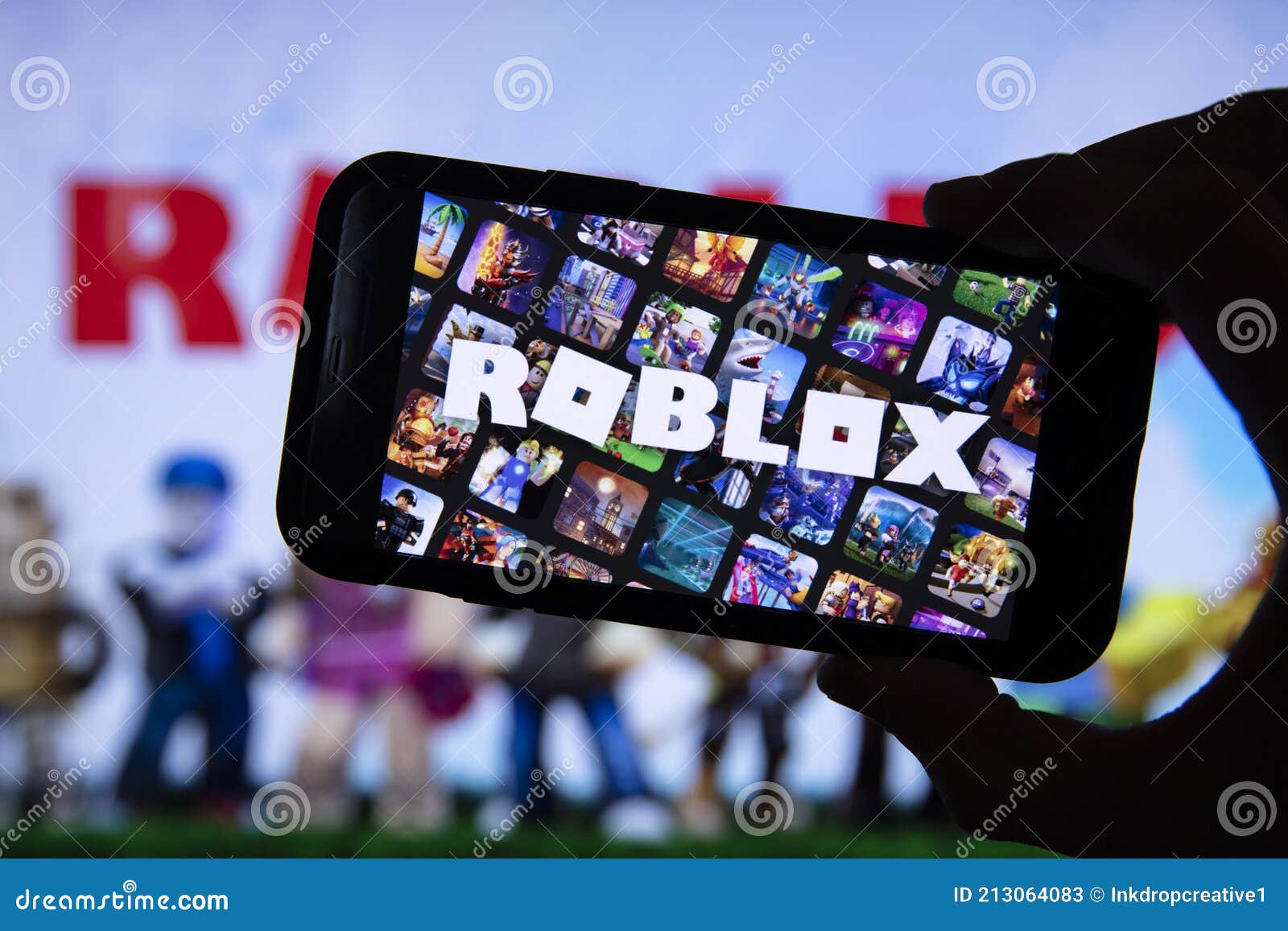 Person holding smartphone with website of US video games company Roblox  Corporation on screen in front of logo. Focus on center of phone display  Stock Photo - Alamy