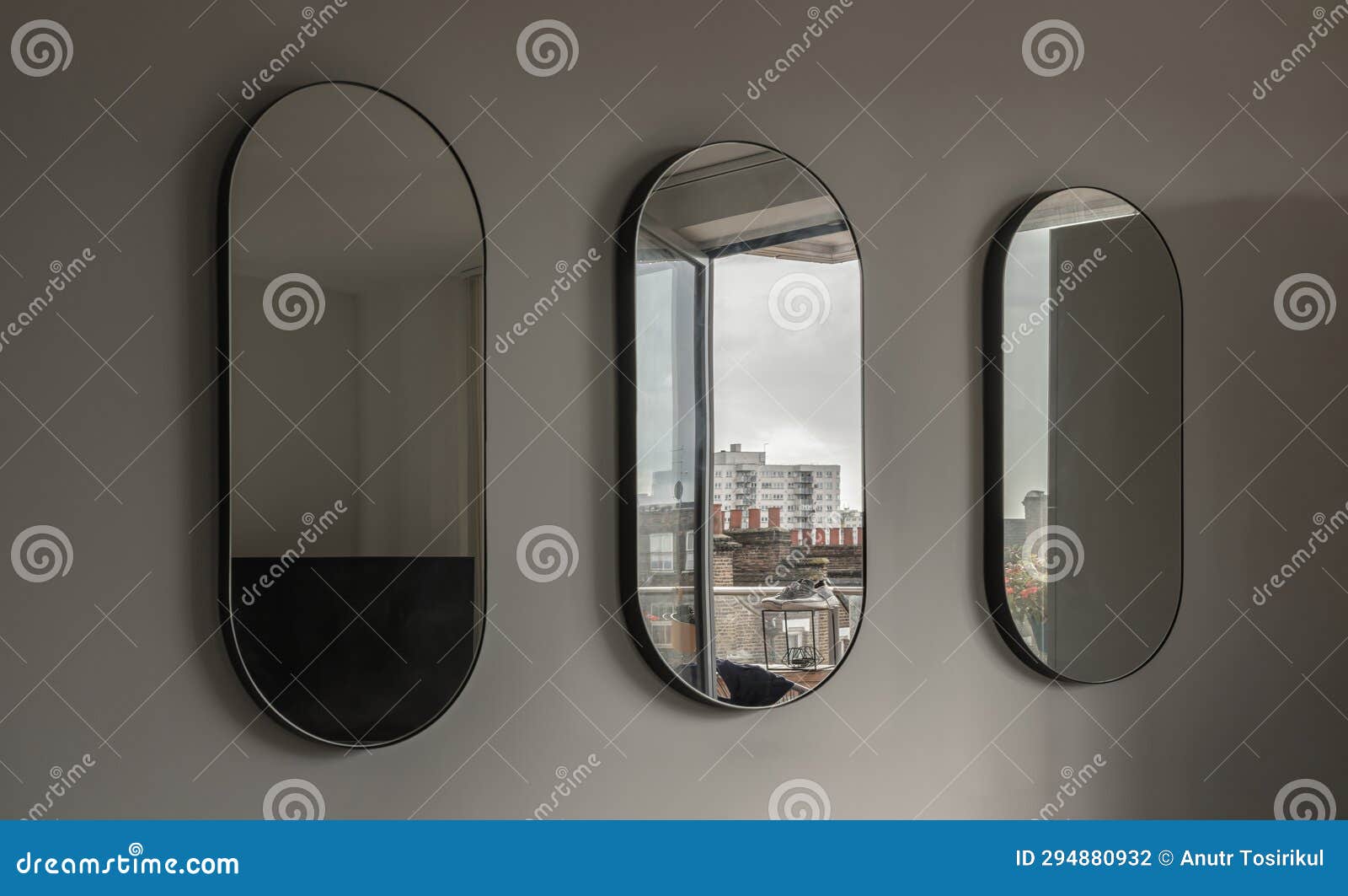 view of three capsula pill d mirror on white wall