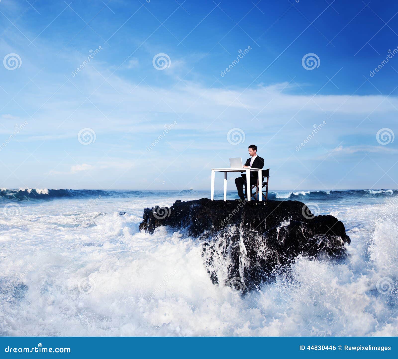 lone business man working on a remote rock