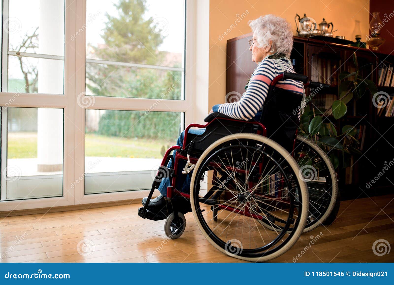 loneliness senior woman sitting in wheelchair at nursing home