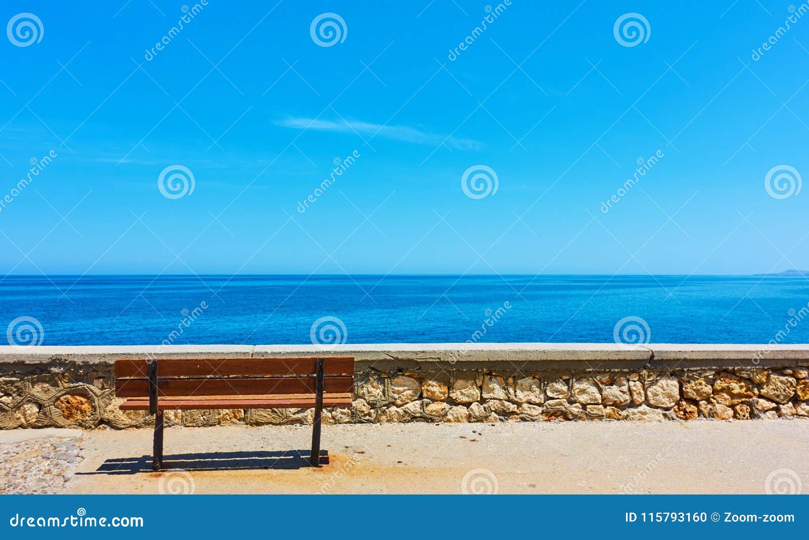 lonely bench near blue sea