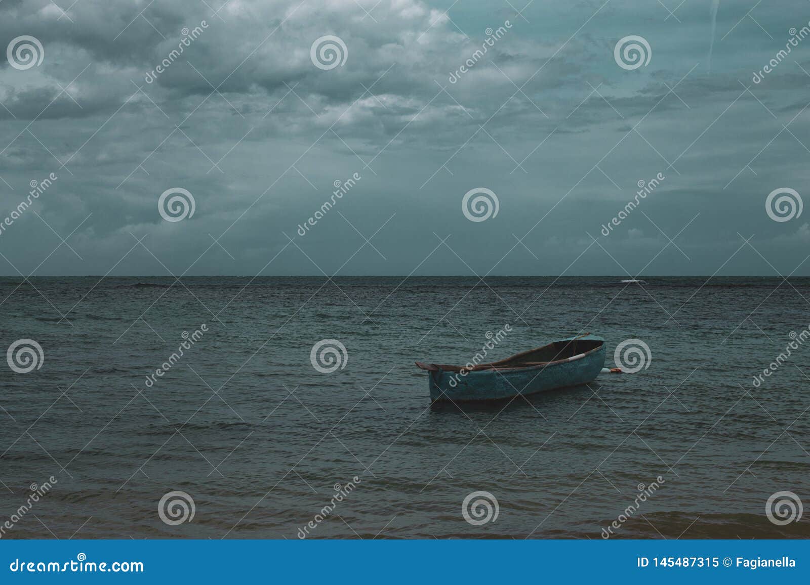 a lonely boat in the sea in playa ballenas, las terrenas, dominican republic