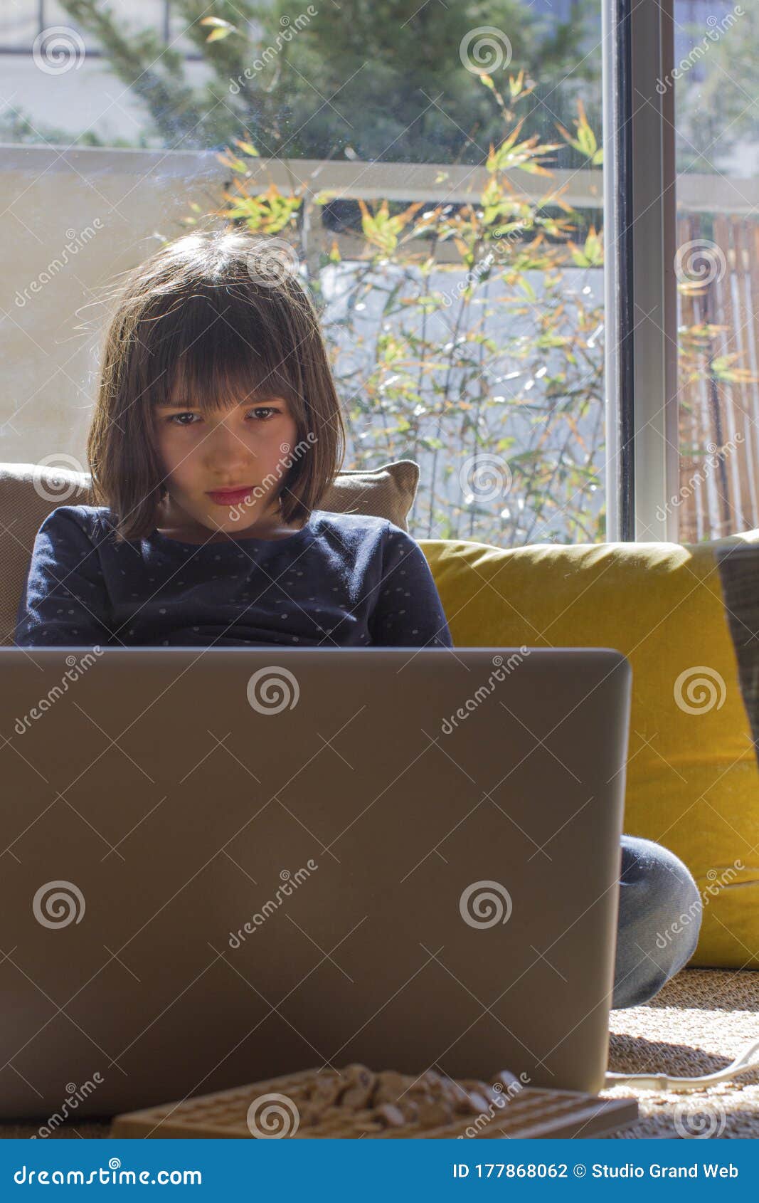 lonely child hypnotized by computer for homeschool learning, screen overdose