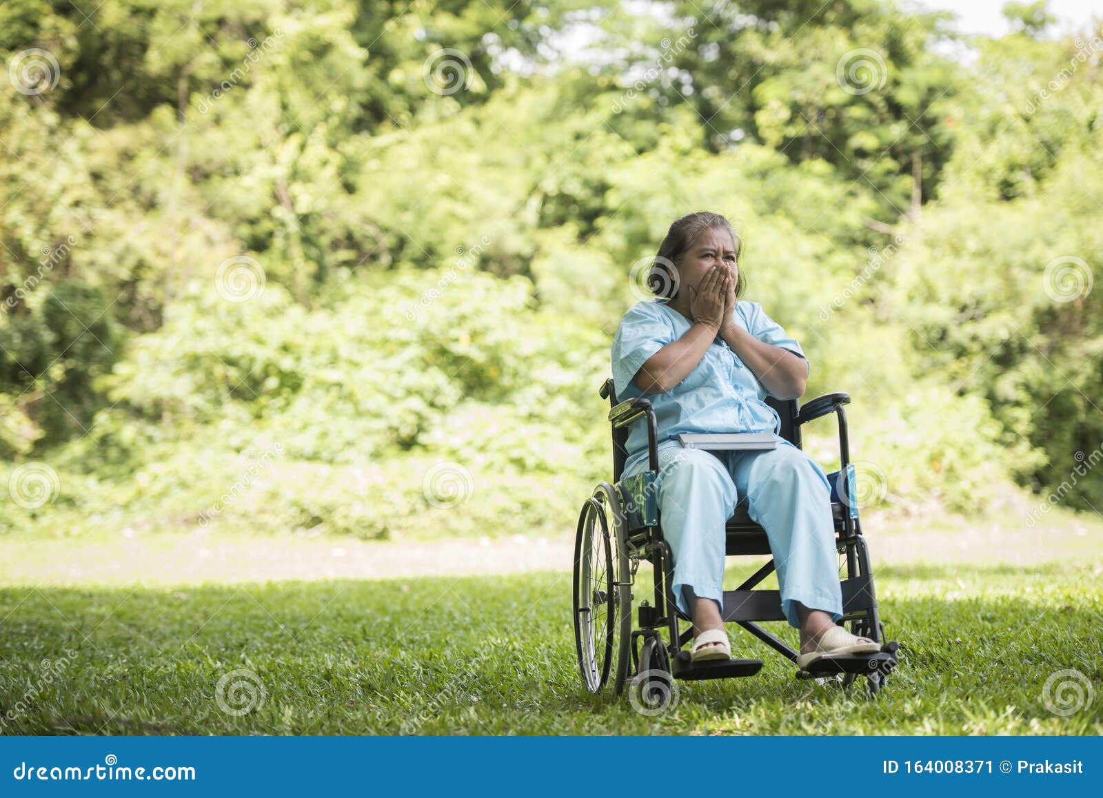 Lonely Elderly Woman Sitting Sad Feeling on Wheelchair at Garden Stock ...