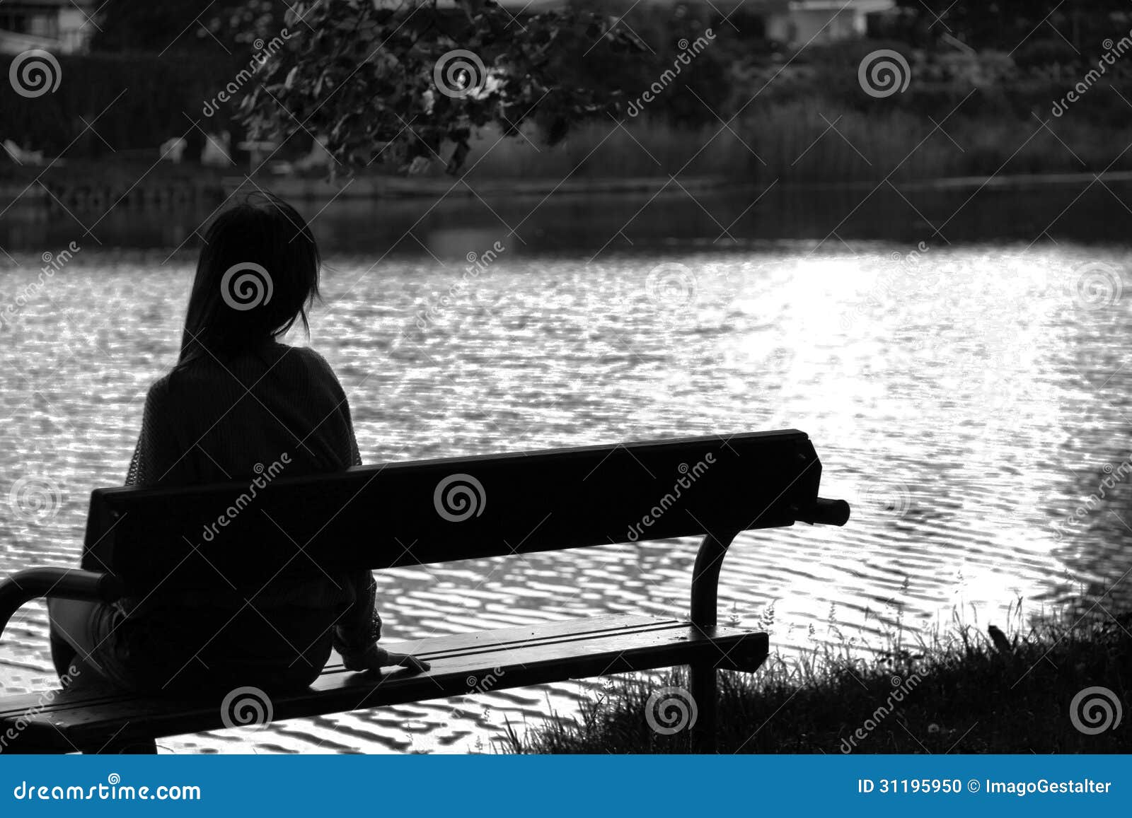 lonely girl by the lake