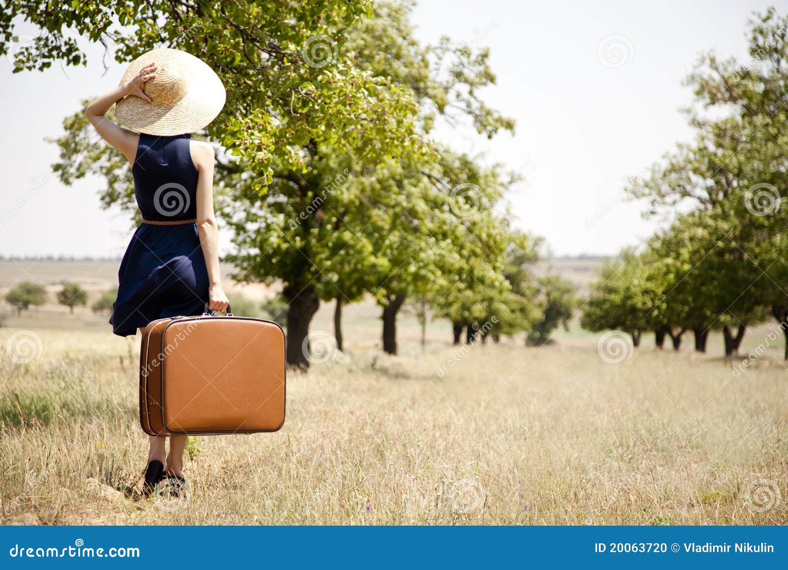 Lonely Girl with Suitcase at Countryside. Stock Photo - Image of field ...