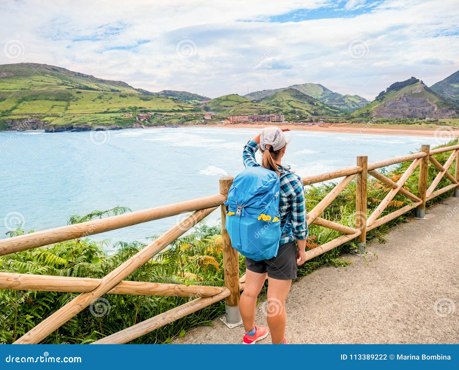 lonely pilgrim with backpack walking the camino de santiago