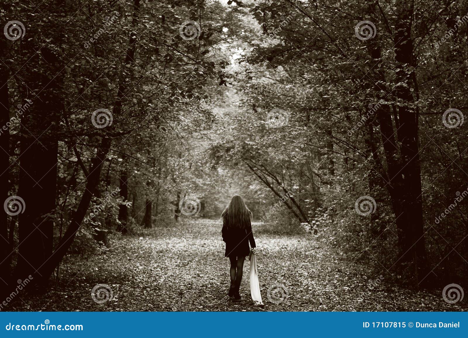 lonely sad woman on the wood road