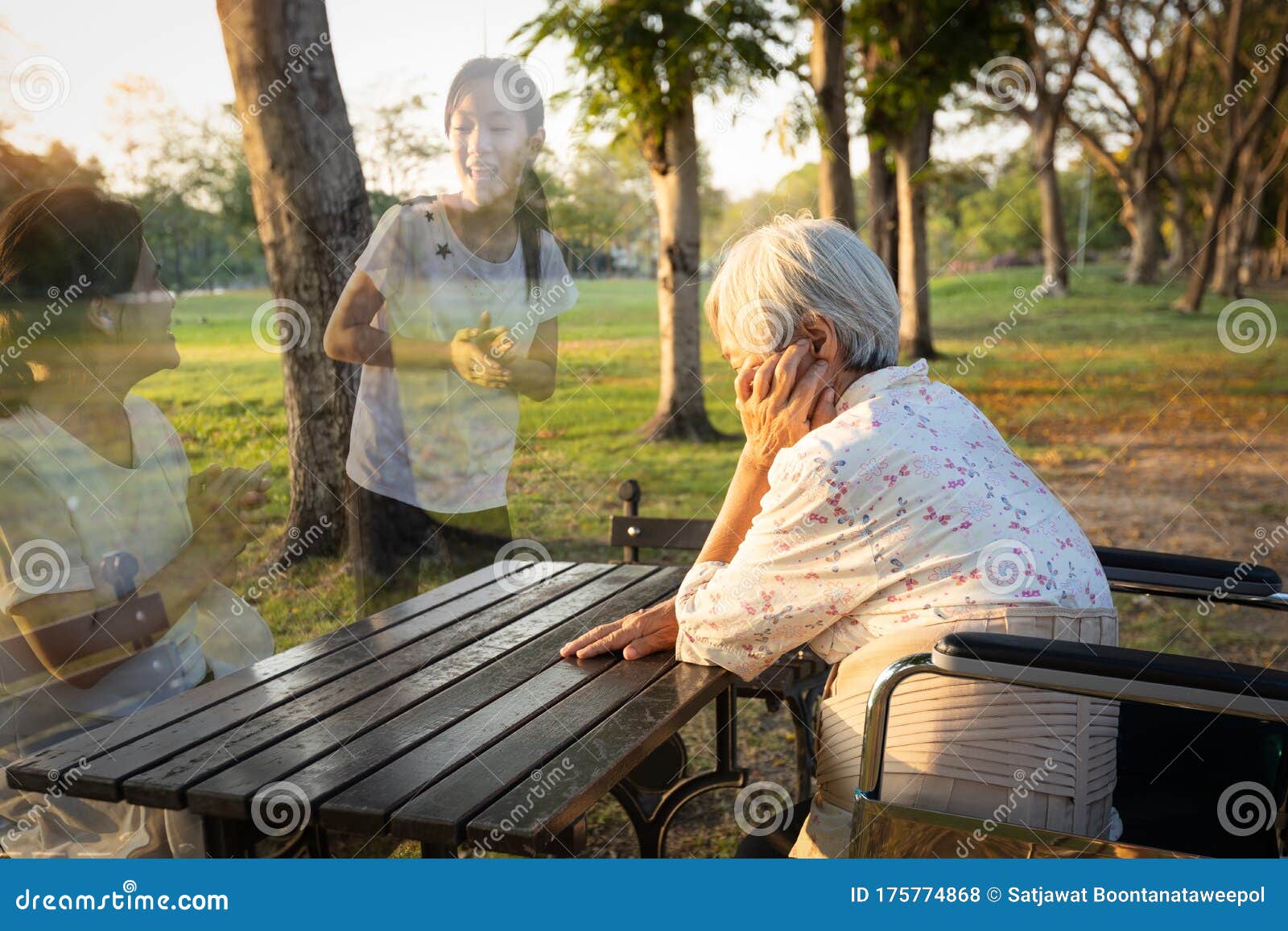 a lonely senior woman is waiting and thinking old memories of her family that will visit her again,depressed elderly people with