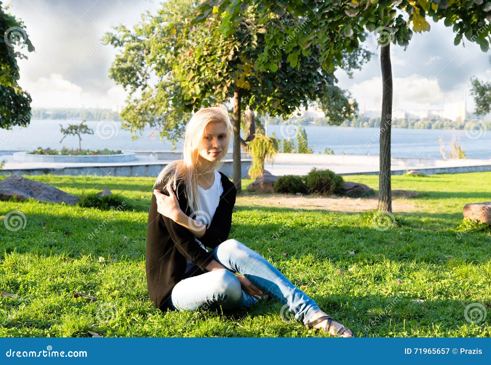 Lonely Woman is Resting Sitting on the Grass in the Park Stock Image ...