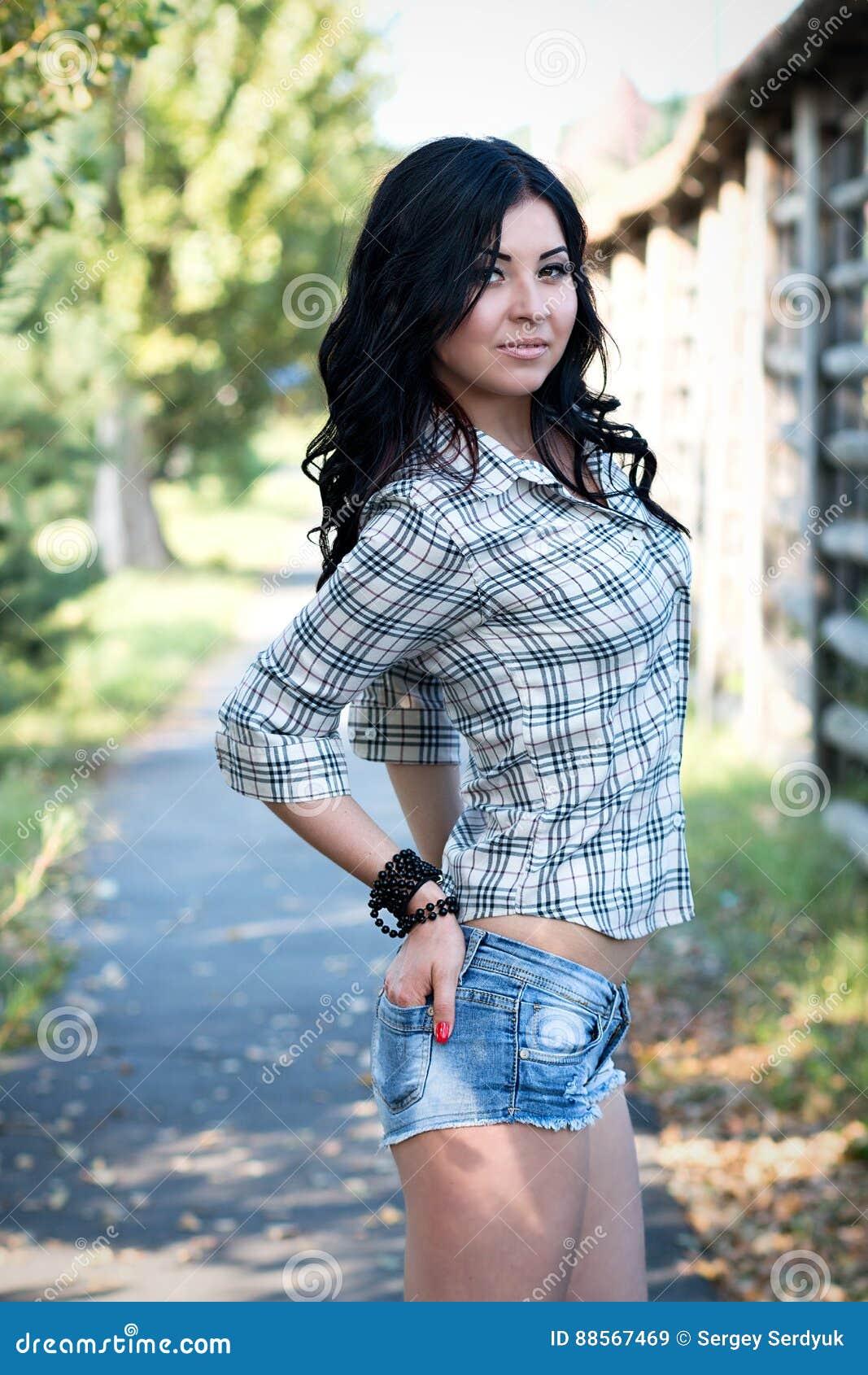 Lonely Young Brunette Woman Walking on the Side of the Road Stock Image ...