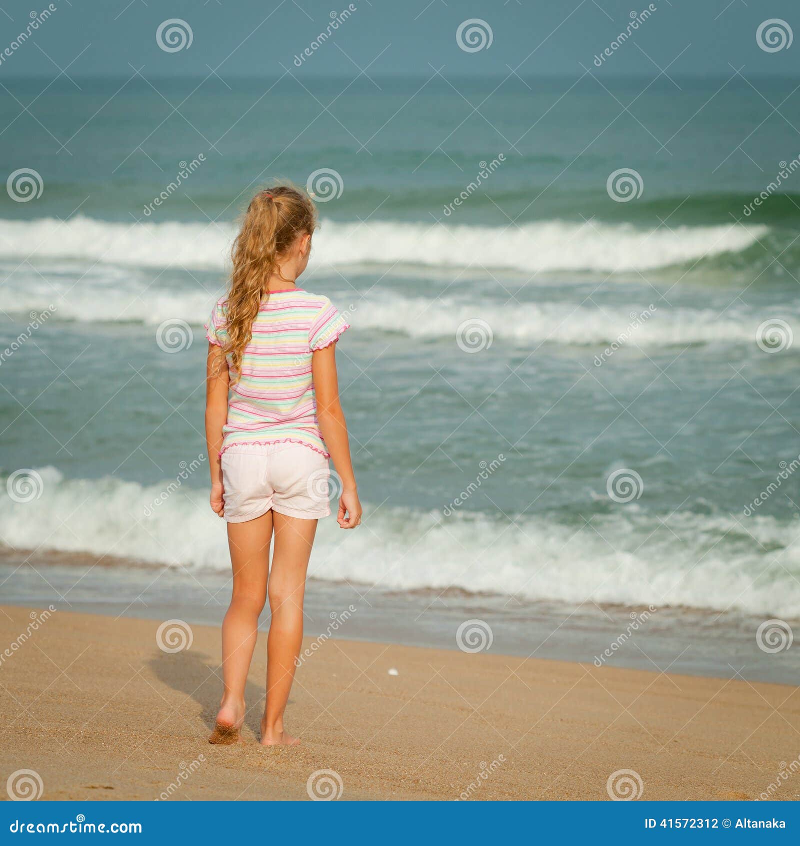 Lonely Young Girl Walking on the Beach Stock Photo Image of child