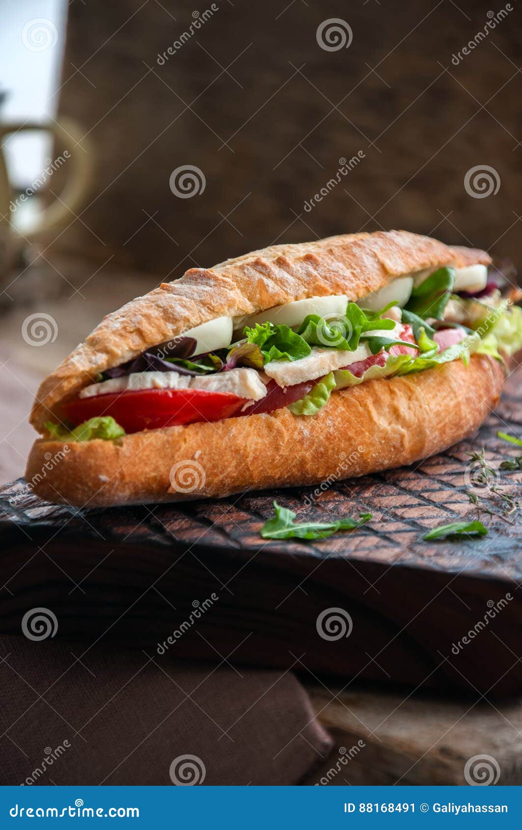 Long Baguette Sandwich with Lettuce Tomatoes Eggs Onion and Mayo Stock
