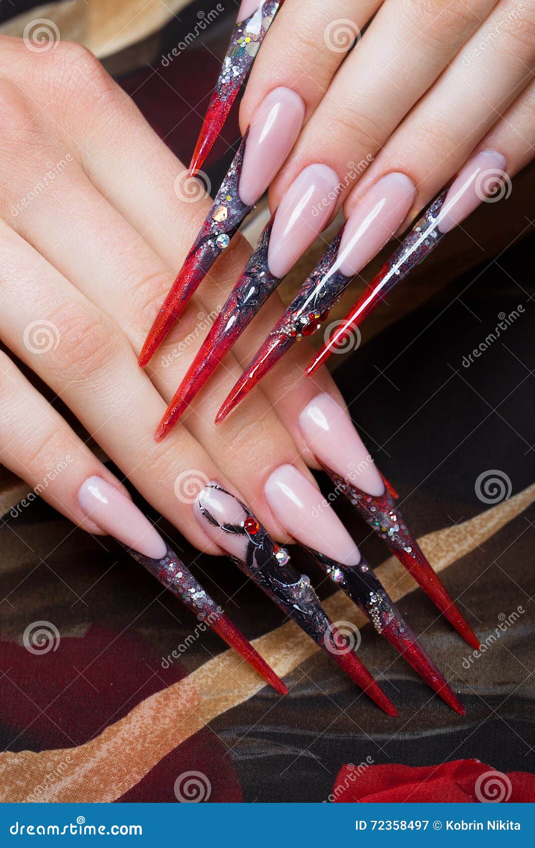 long beautiful manicure fingers black red colors spider nails design close up picture taken studio white 72358497