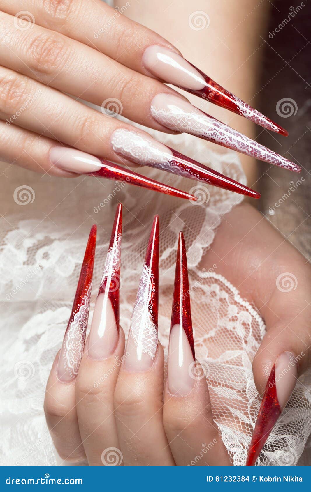 long beautiful manicure with lace on female fingers. nails . close-up