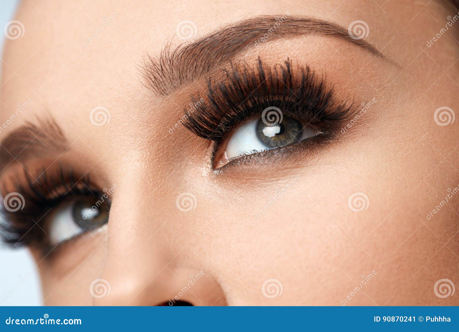 long black eyelashes. closeup beautiful female eyes with makeup