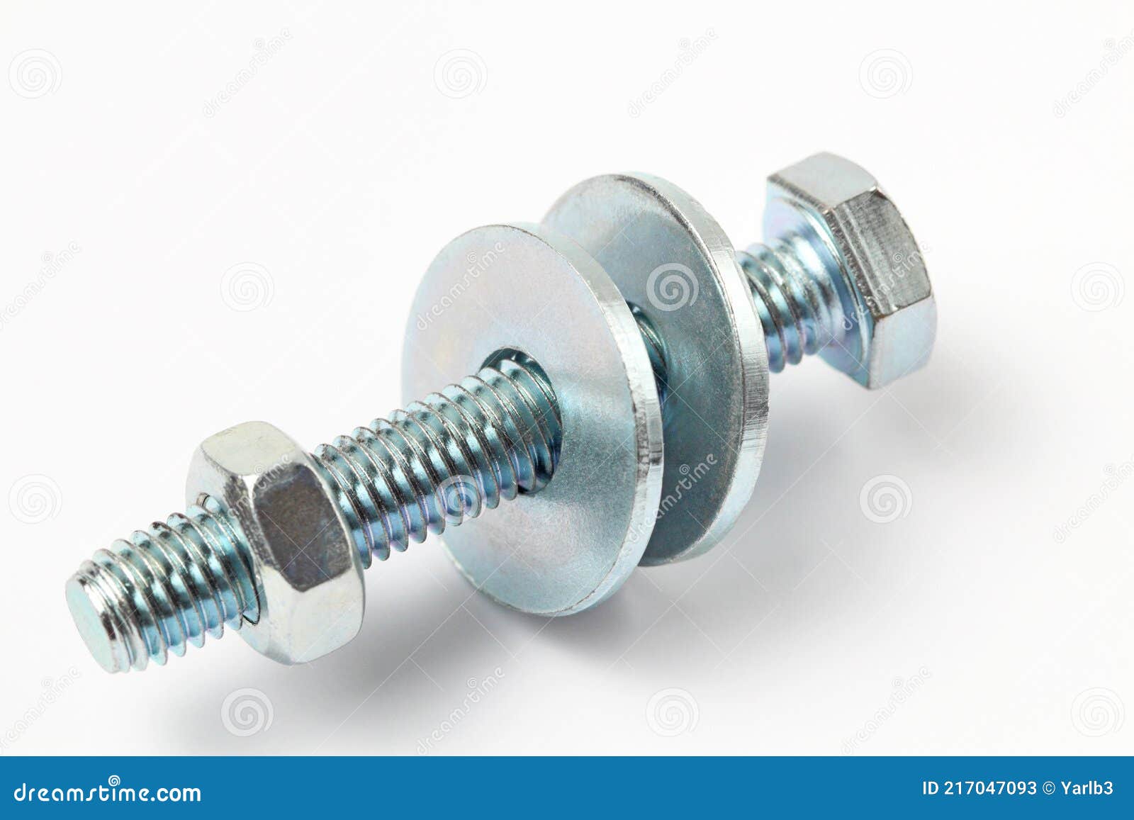 A Long Bolt with a Nut and Two Washers on a White Background, Closeup