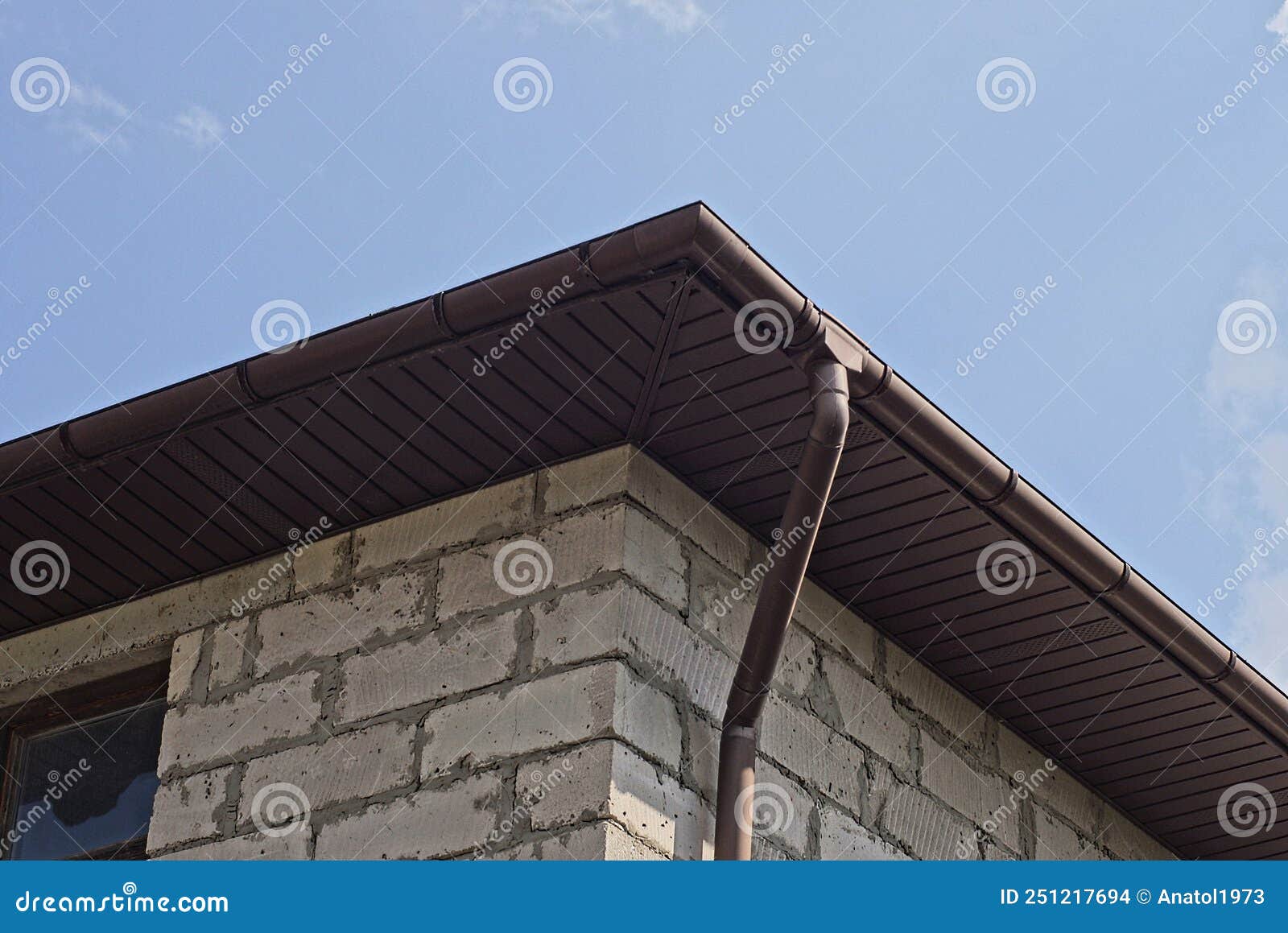 Long Brown Plastic Gutter Pipe on White Brick Wall Stock Photo Image