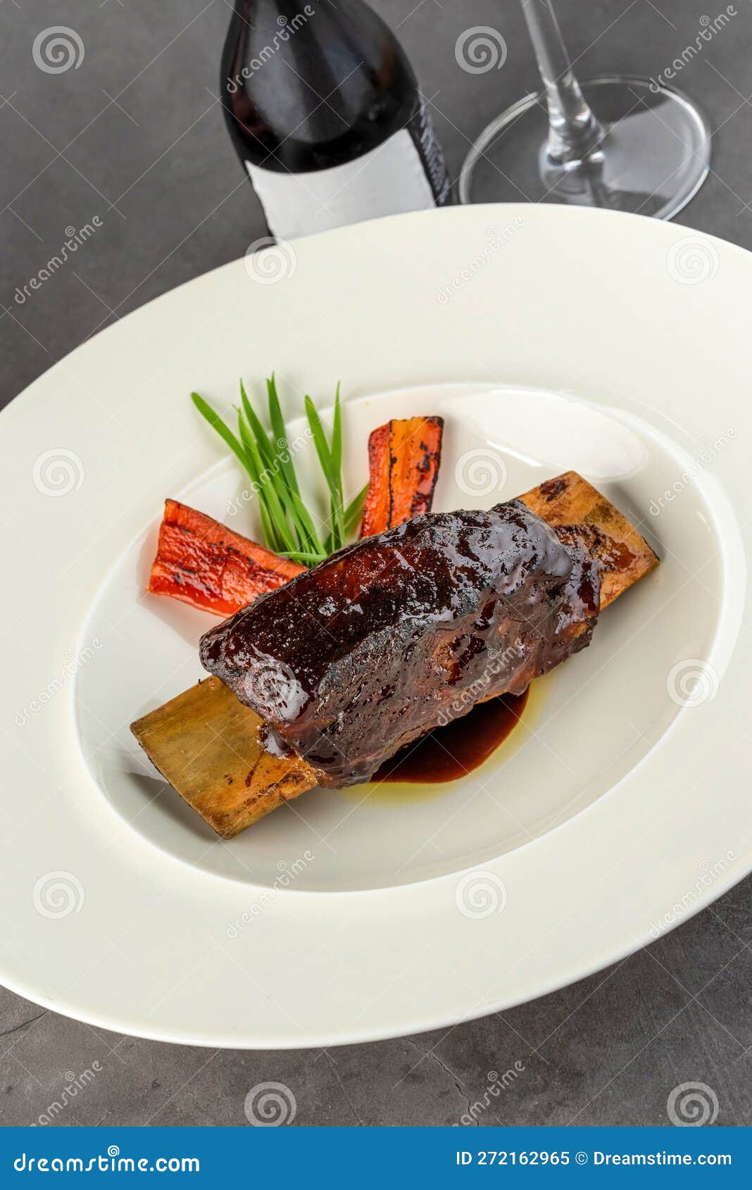 Long Cooked Marinated Beef Ribs on a White Porcelain Plate Stock Image