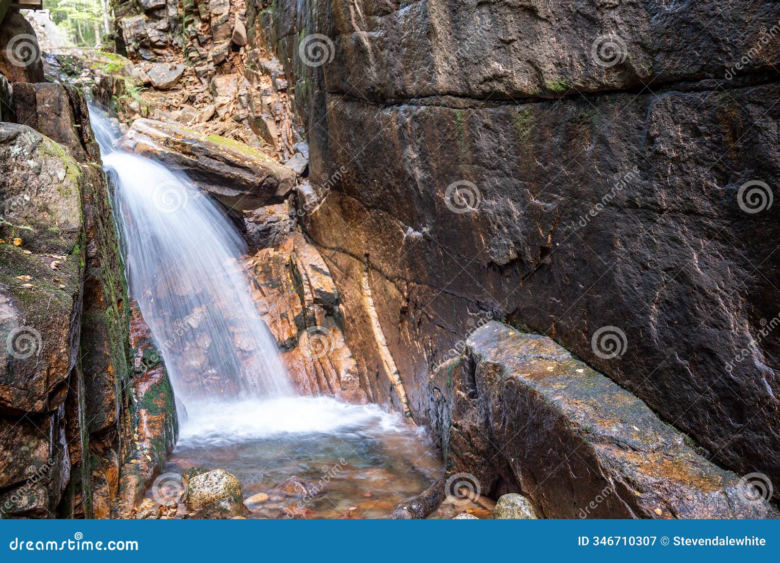 long exposure cascading waterfall at flume gorge in the franconia notch state park